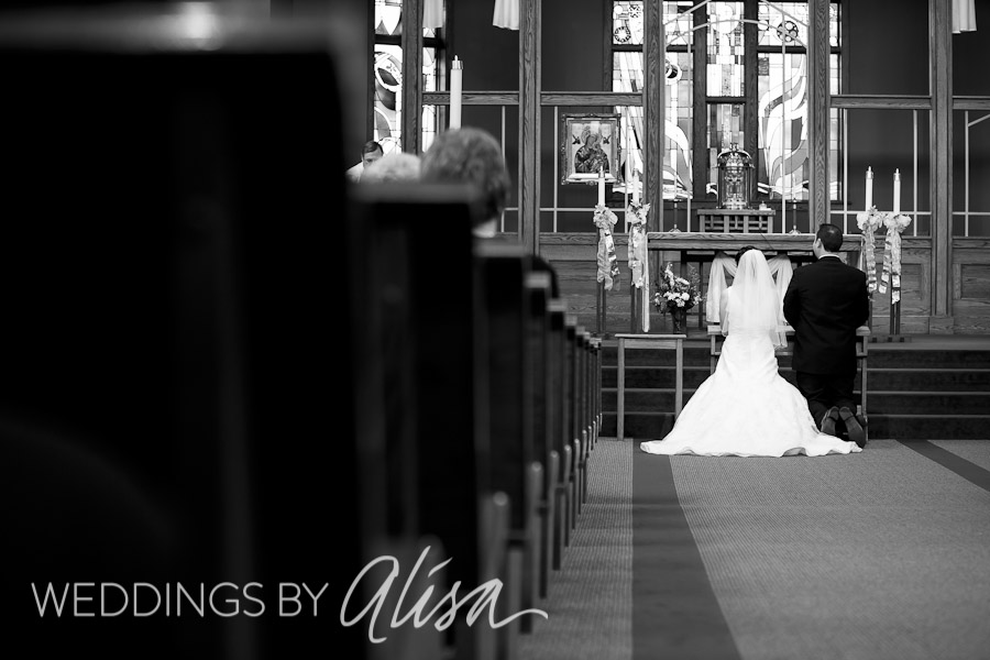 st-bonaventure-pittsburgh-wedding-photographer-photos-ceremony-17 Bride and Groom kneeling during Mass at St. Bonaventure Wedding Pittsburgh